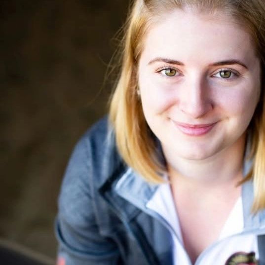 Young woman smiling at the camera.