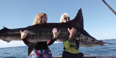 A girl with a Marlin in Mexico, Cabo.