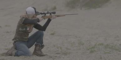 Amanda Lynn Mayhew with her Weatherby Rifle in Manitouwadge.