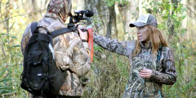 Amanda Lynn Mayhew talking on camera about her television show with her cameraman while producing.