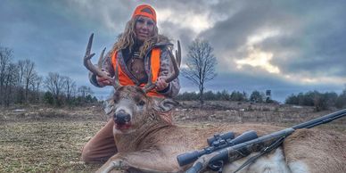 Amanda Lynn Mayhew with a deer taken with a muzzle loader at 149 yards.