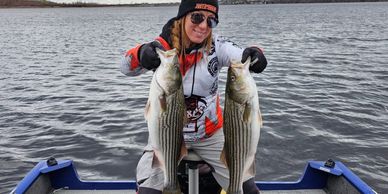 Amanda Lynn Mayhew and striper bass fish in Miramichi.