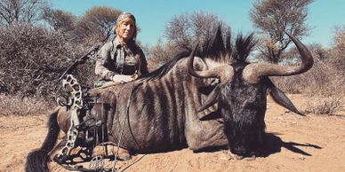 Amanda Lynn Mayhew with a wildebeest in Africa.