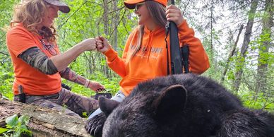 Two girls on a bear hunt in Saskatchewan.