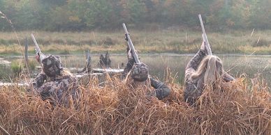 Three girls waterfowl hunting.