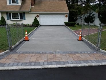Newly paved driveway at a suburban home.