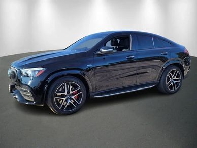 Sleek black luxury SUV with sporty design and tinted windows.