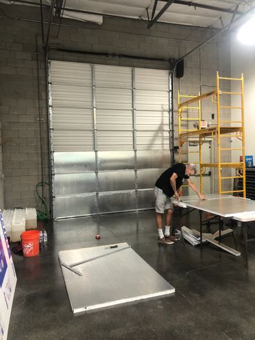 CR-40 installing R-6 insulation on a commercial garage door in Arizona
