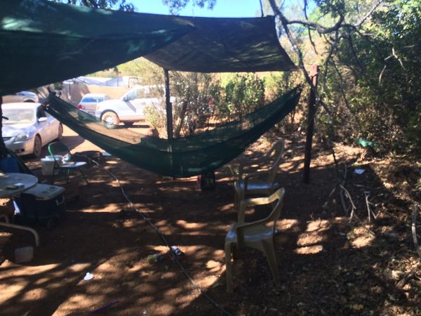 Outdoor shelter with hammock