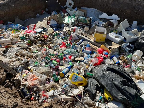 Trash pit with chemical bottles