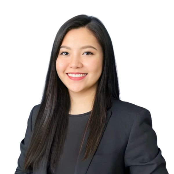 Professional woman with long dark hair smiling in a black blazer.