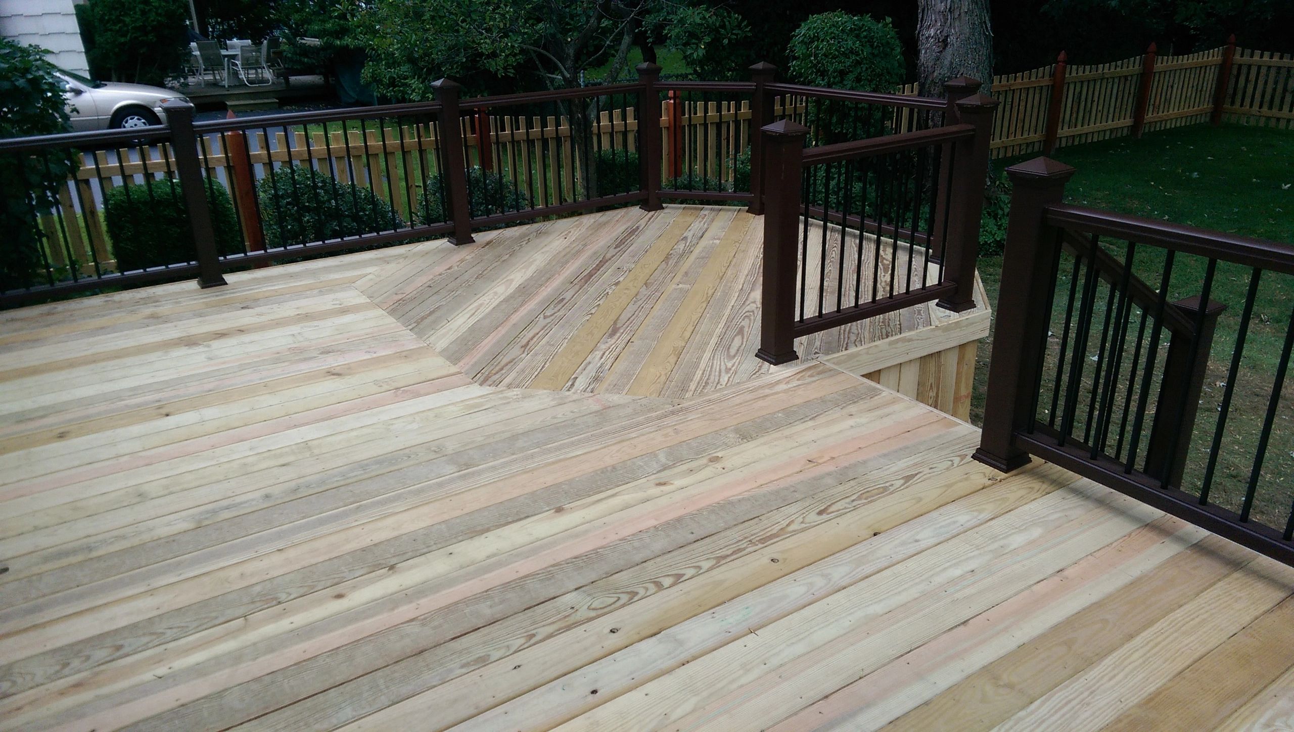 Premium Pressure Treated wood decking with full skirt, Trex Vintage Lantern Railings, holding lights