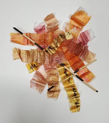Woven collage created from transparent painted paper and sticks accent.
sold