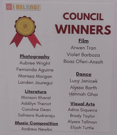 A board listing council winners in various categories like Photography, Literature, Music, Film, Dance, and Visual Arts.