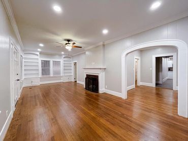 Hardwood floor 
Grey walls 
Arch way