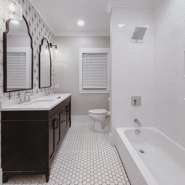 Black vanity 
White tile