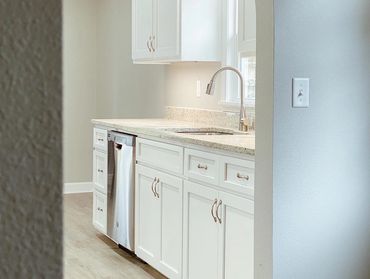 White kitchen cabinets 
Grey walls