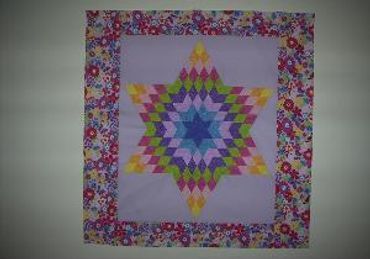 OFFICIAL SITE Diane's Native American Star Quilts.  https://www.dianesnativeamericanstarquilts.net