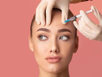 Woman getting injected with botox or jeuveau