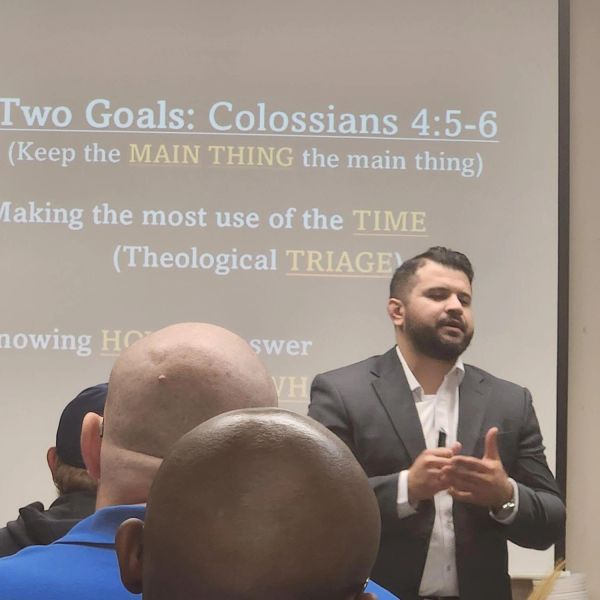 Man giving a presentation on Colossians 4:5-6.
