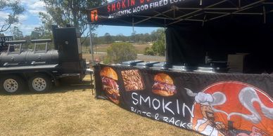 Smokin Butts & Racks Low & Slow BBQ Smoker Trailer catering with Brisket, Pork, Chicken, Ribs, Salads