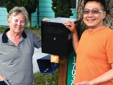 Peter Kwon and neighbor with secure, locking mail box