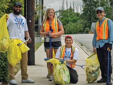 Peter Kwon and clean up work crew on sidewalk