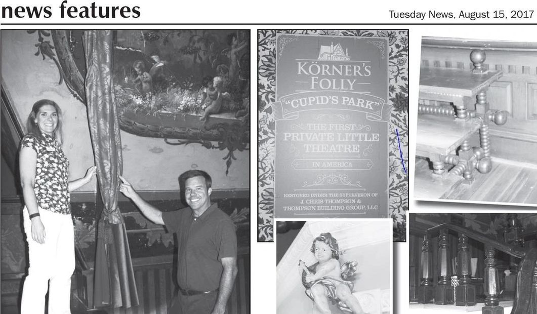 Two people posing beside a curtain in an old theater with vintage decor.