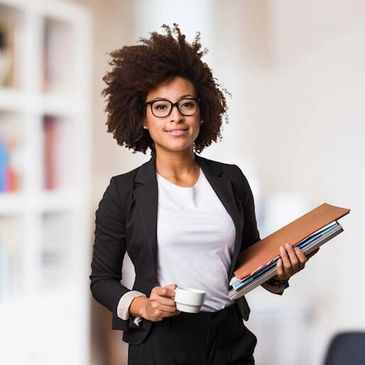 a woman with files in one hand and a cup in another