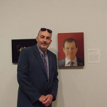 Portrait Artist Paul Anthony Barker at BP Portrait Award 2013 with his portrait of Alastair Campbell
