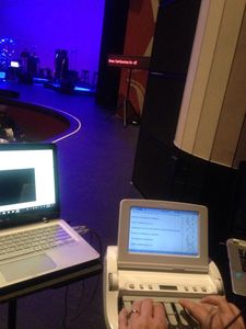 photograph of concert open captioning