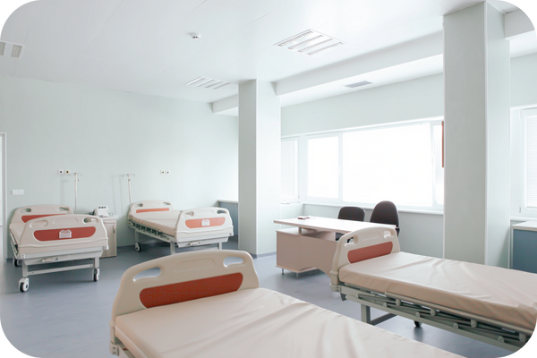 Hospital casualty room with beds and chairs, ready for emergencies and patient care.