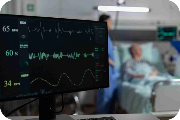 ECG monitor displays heart activity with EEG, EMG, NCS, and Doppler labels for analysis.