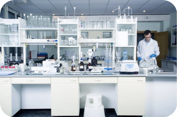 Modern laboratory with microscopes, test tubes, and computers for scientific research.