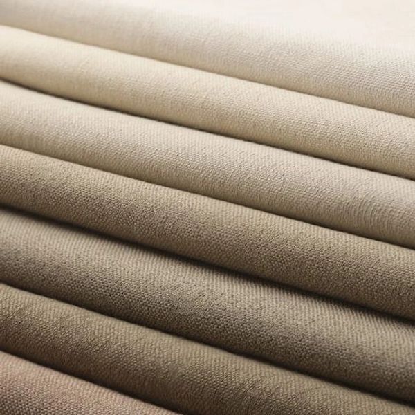 layers of curtain fabric stacked on top of eachother