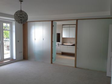 Frosted glass to secure privacy for a large bathroom.