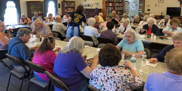 About 60 senior citizens gathered at the community house in Howe Village in August to enjoy a delici