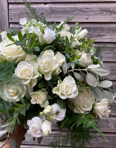 White Rose and lisianthus with foliage wedding bouquet