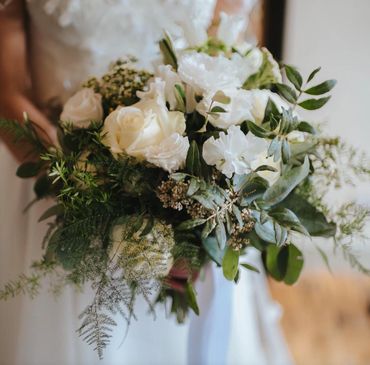 White flower and foliage bridal flower tied bouquet