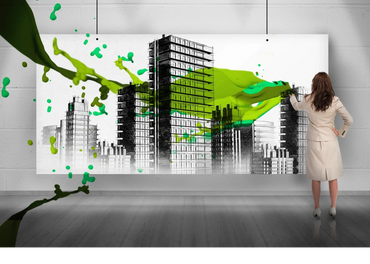 lady looking at large picture of energy efficient buildings.