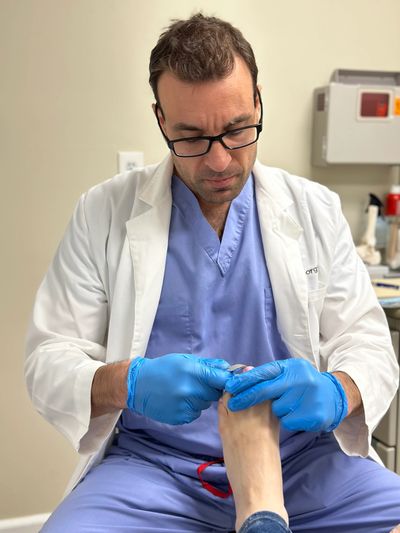 Podiatrist foot doctor exam nail fungus and ingrown toenail. 