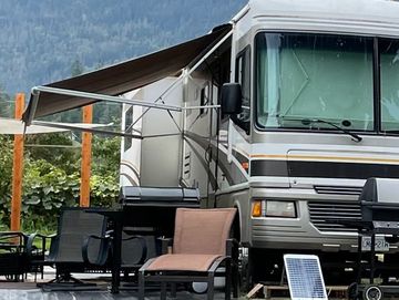 RV & side seating area with bbq park view 
Lakeside glamping JazzFest  Kaslo