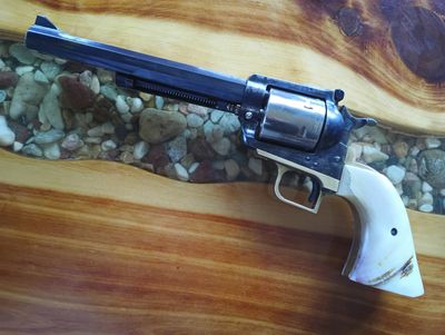 3 screw 44 mag, 7 1/2" Tapered octagon barrel, Colt New Frontier front sight and ejector housing, Co