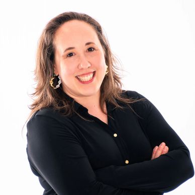 South Sound Dance instructor smiling in staff portrait, black blouse