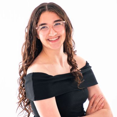 South Sound Dance modern and ORCA instructor smiling in staff portrait, glasses.