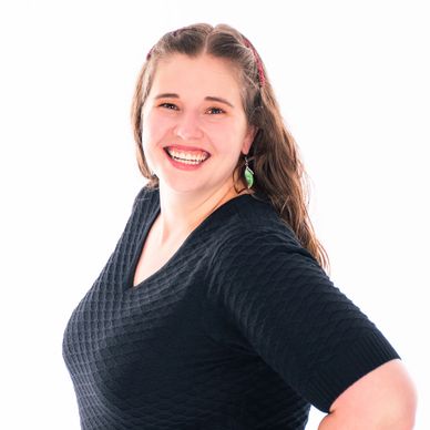 South Sound Dance Fine Arts Preschool Director smiling in staff portrait, black top