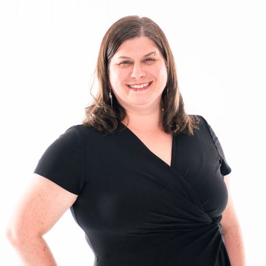 South Sound Dance Operations Manager smiling in professional headshot, black top.
