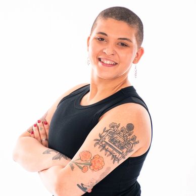 South Sound Dance Customer Experience Coordinator smiling in staff portrait, black top.