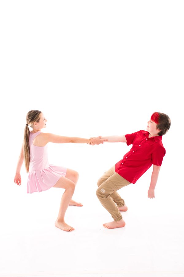 Dancers at South Sound Dance showing teamwork in partner pose, Tumwater WA.
