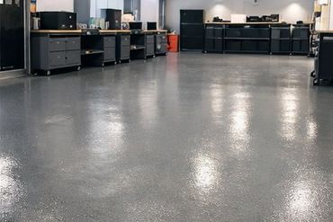 Various polished resin and stone floors in living rooms, garages, and workshops.